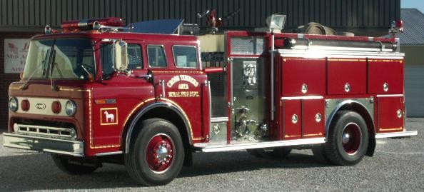 Old Engine 4-9-1 going to its new home in Crosstimbers, Hickory County, Missouri. Note that our White Horse logo was left on the door. (Jon's Midamerica Fire Apparatus photo)